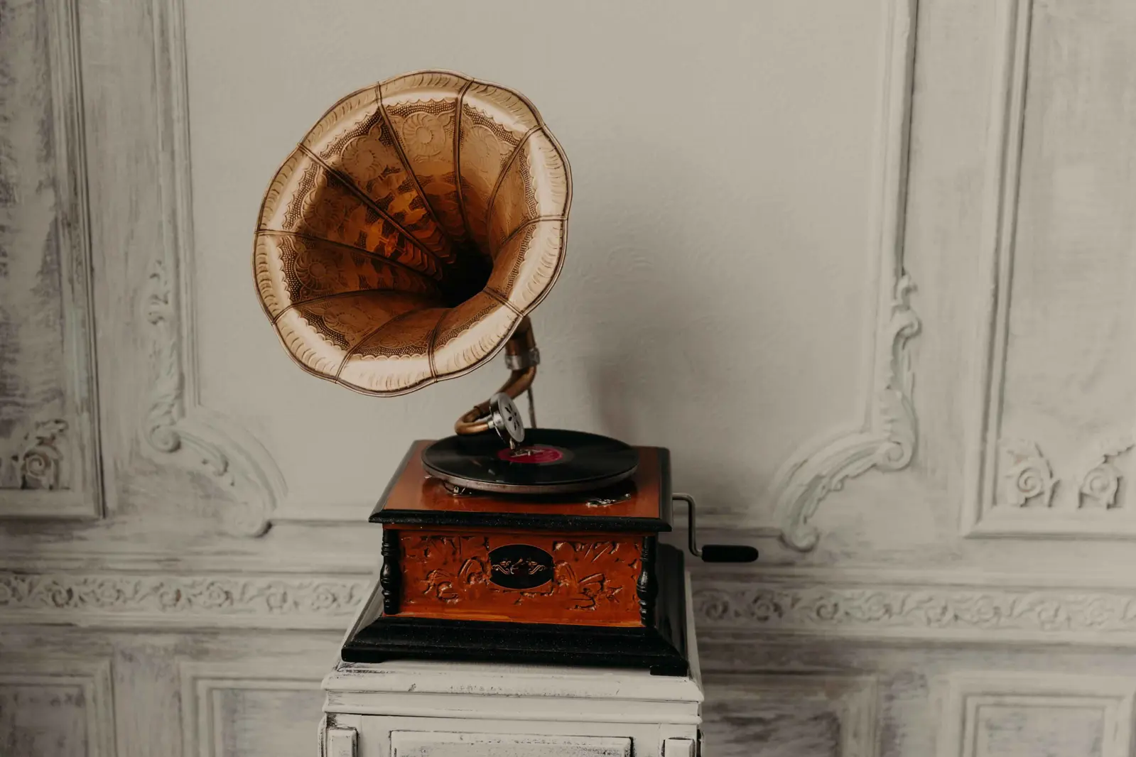 A photograph of a phonograph, a monumental technological development that is now obsolete